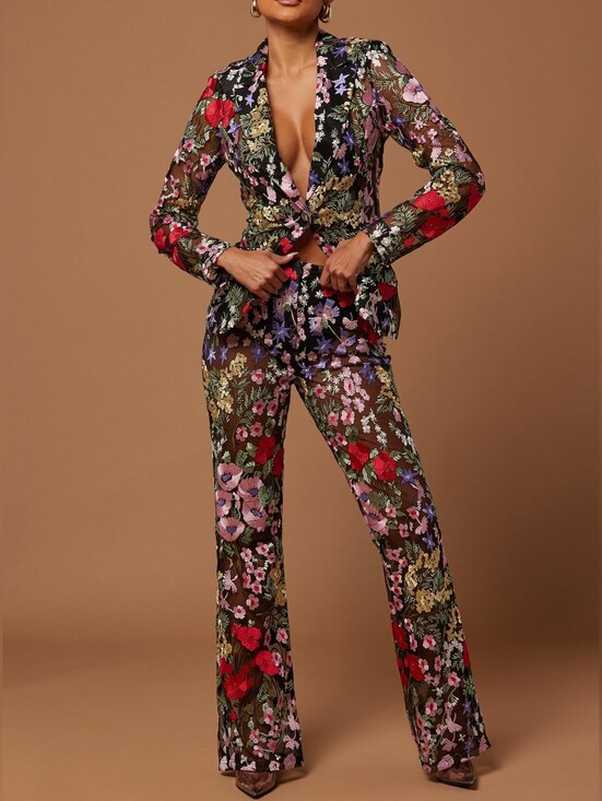 Jackets & Blazers - An elegant and bold women's two-piece trouser suit made of transparent black